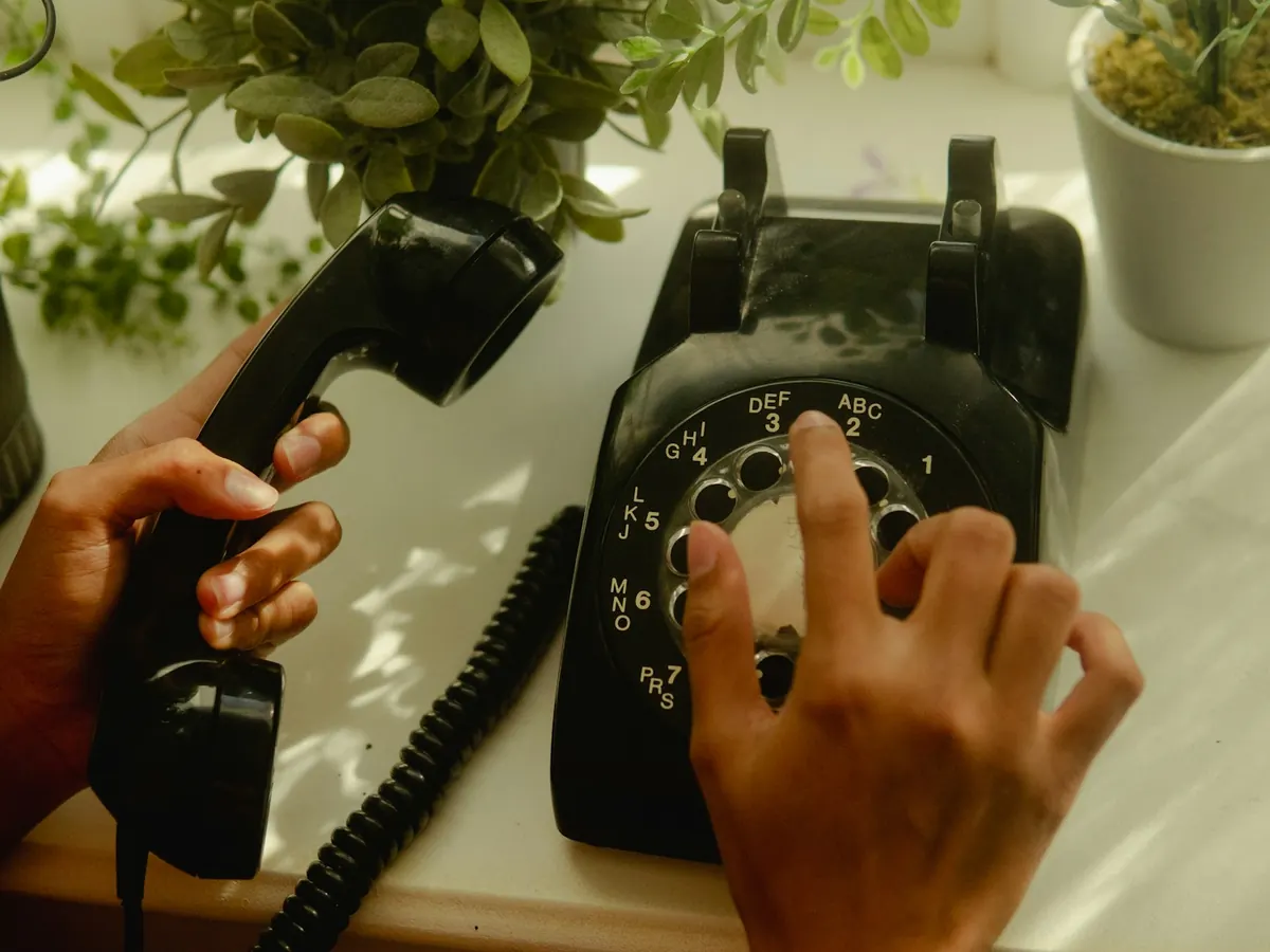 Person dialing a rotary landline